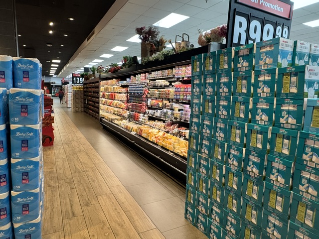 Baby Soft toilet paper and dairy promotion display in-store