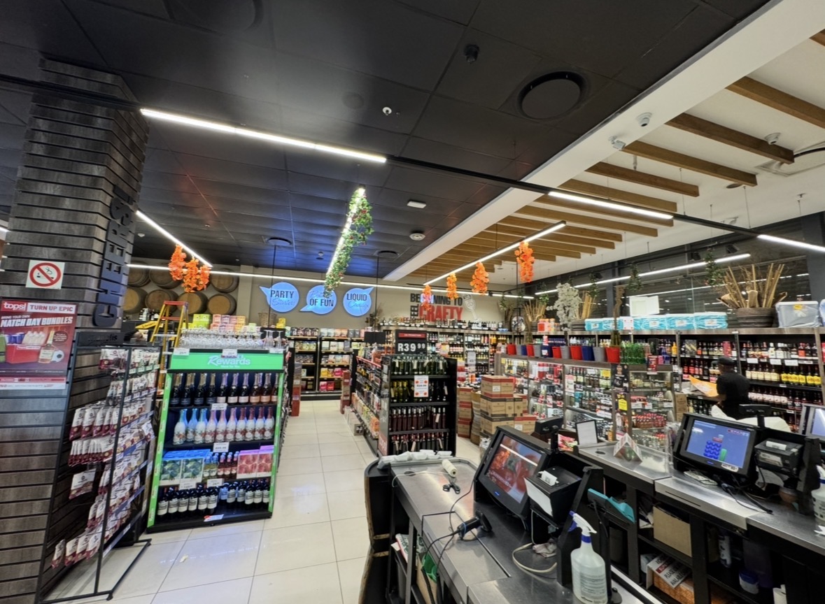 Tops liquor section and checkout counter at Richdens SUPERSPAR