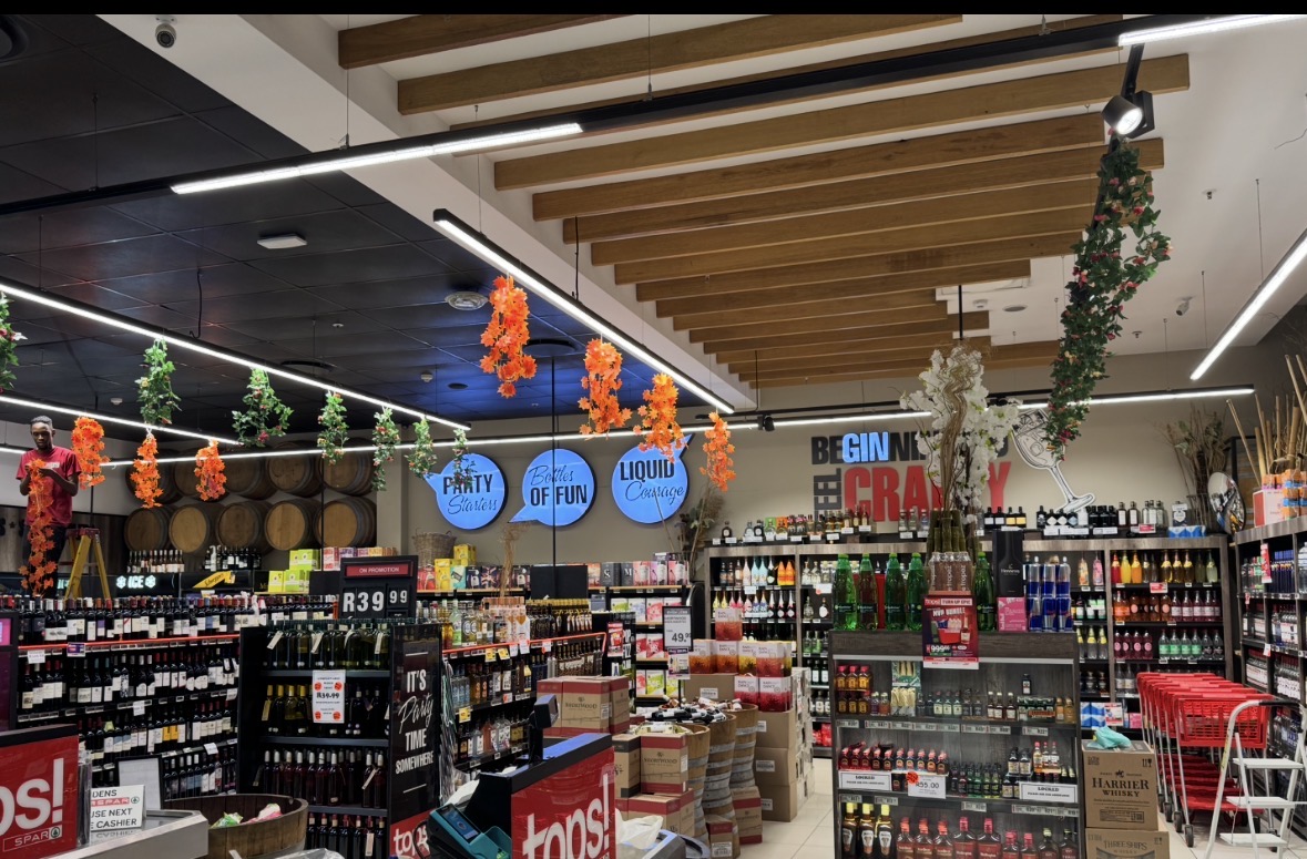 Tops liquor aisle with wine and spirits on promotion