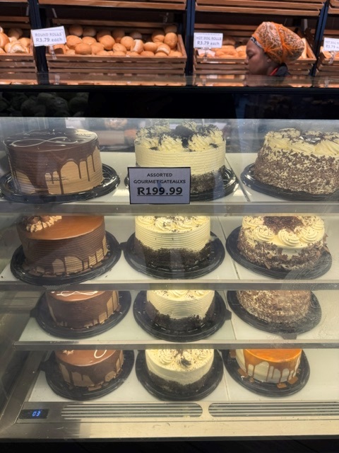 Assorted gourmet cakes in the bakery display case