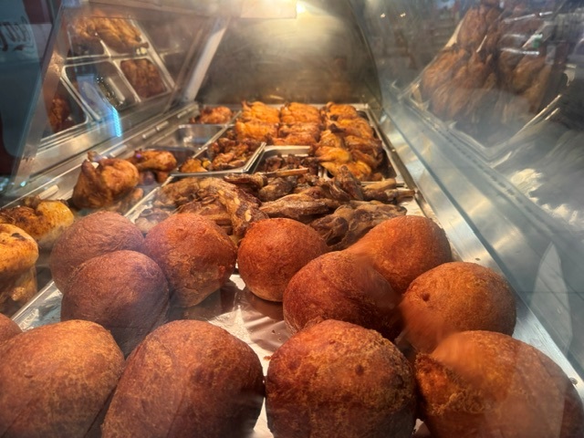 Fried chicken and vetkoek in the hot food display