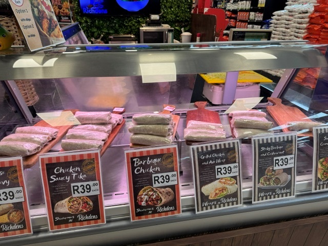 Chicken and beef wraps in the deli display