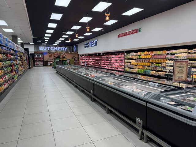 Butchery and fresh meat section viewed from the grocery aisle